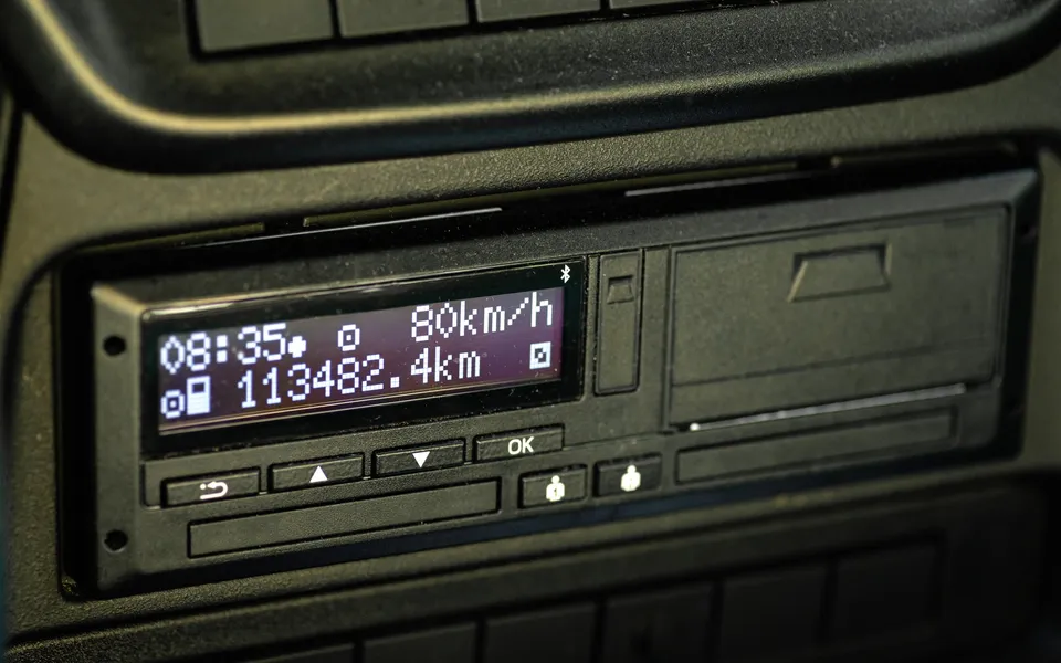 A digital tachograph unit in a dashboard